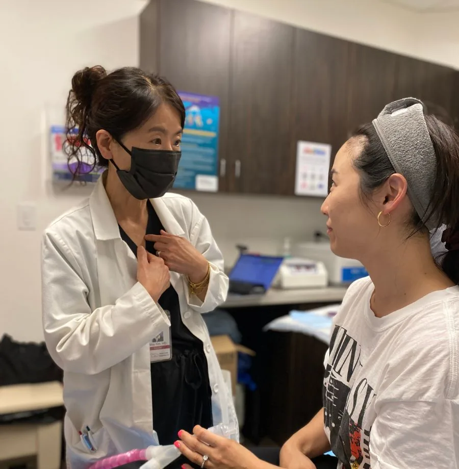 Physician performing an aesthetic treatment at VitaleHEALTH Med Spa